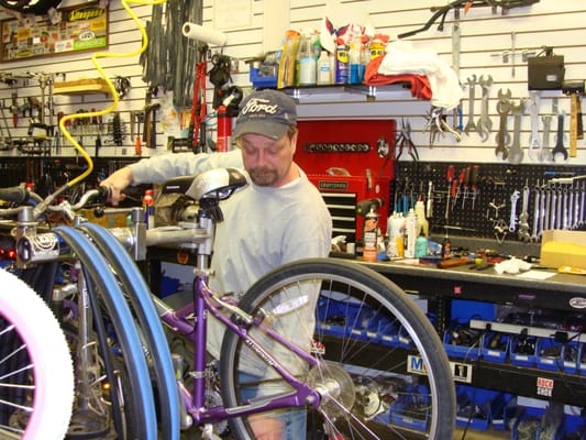 Jeff Carlson, owner of The Bike Shop, working on a bike.  We have great prices on bike repairs.