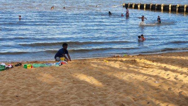 My son playing in the sand