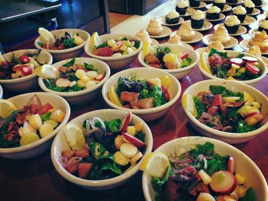 Thursday Lunch side salads ready for the masses (delicious desserts in the background).