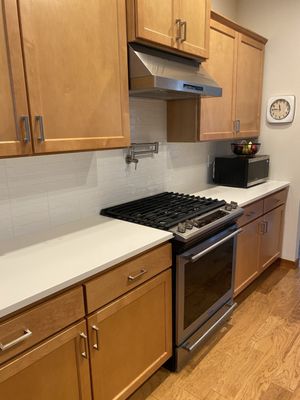 White Quartz countertop throughout.