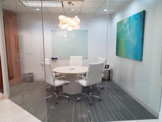 small conference room with shades that pull down for privacy