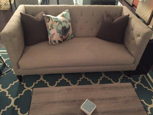 Small sofa with custom pillows from Schoenfeld Interiors