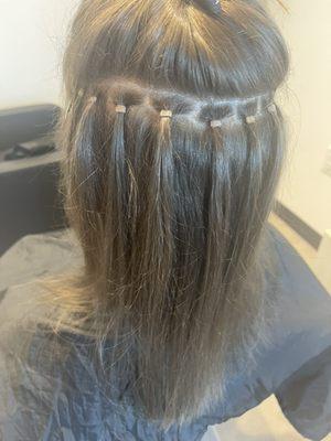 Hand tied weft extensions