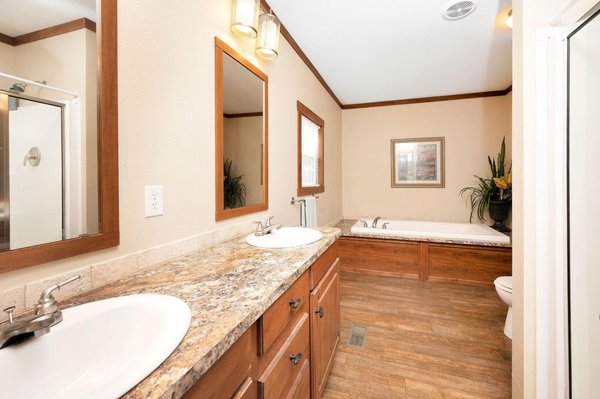 Dual sinks, granite and vinyl floors throughout!