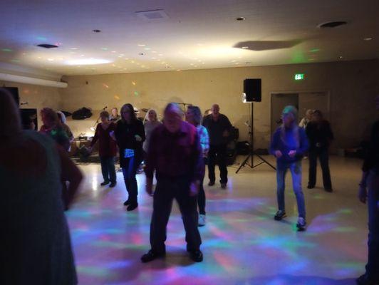 Line dancers dancing to Mustang Sally at Interaction, Inc of Richmond, IN's singles dance at Fraternal Order of the Eagles