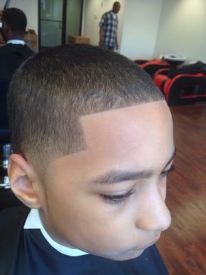 BASIC KID CUT WITH RAZOR OUTLINE.