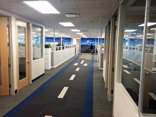 Custom carpet tile installation in Priceline.com corporate headquarters.  Runway out of FLOR carpet tiles...very cool