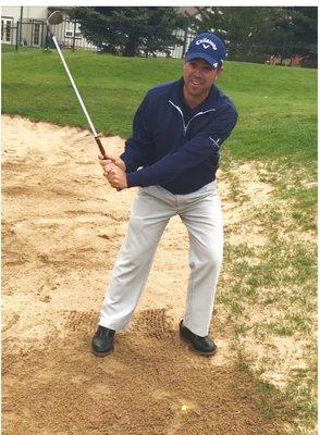 Me demonstrating how to hit out of a sand trap.