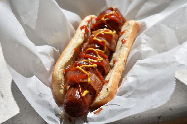 Bacon wrapped Polish dog. Our most popular!