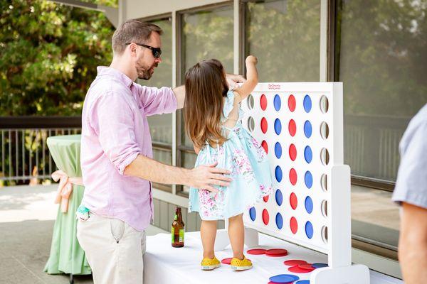 Giant Connect 4 on the balcony near the bar