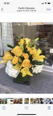 Yellow roses, lillies and white hydrangeas