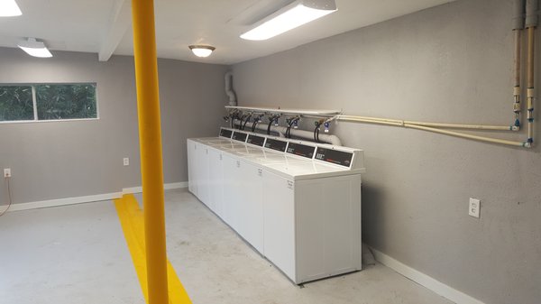 Renovated laundry room with new washers and dryers