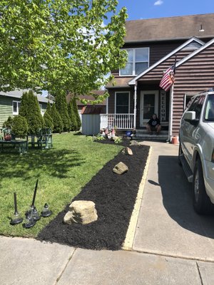 New 4x4 railroad tie installation with Black Mulch garden bed.