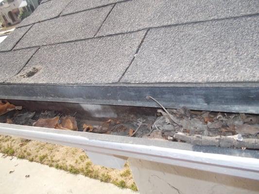 Debris in gutters can lead to premature roof failure