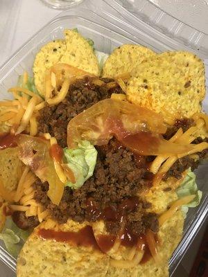 Their version of a taco salad. Yellow tomatoes, stale chips, and missing the sour cream I ordered.