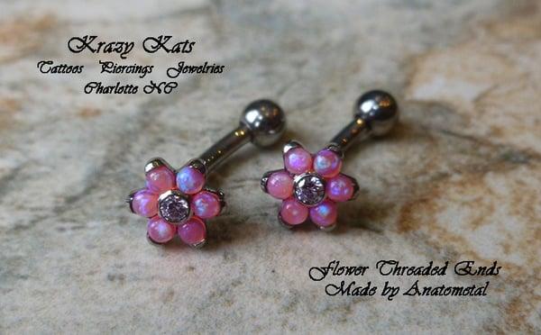 Pink opal flower ends and curved barbell jewelries by Anatometal.