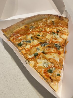 Specialty Slice, with buffalo chicken, buffalo ranch sauce, and blue cheese crumbles