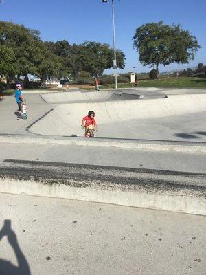 Little kids riding bikes