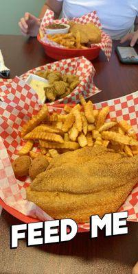 Two catfish plates with fried pickles.