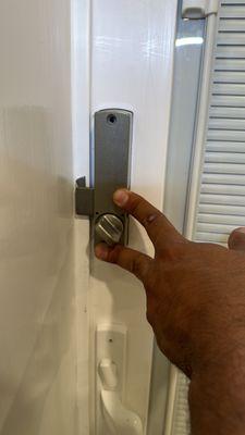 Sliding keypad lock installed on a sliding door