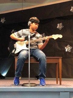 Brandon is playing "time of your life" at his first talent show. He did an amazing job!