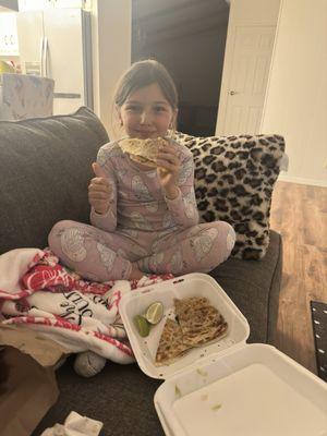 Ava enjoying her carne asada quesadilla. Yum!