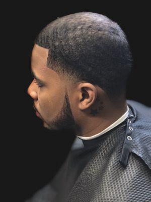 Taper haircut with beard shaping.