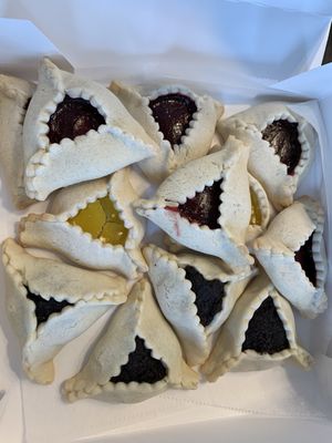 Hamantaschen (medium size) in poppy, raspberry, and lemon around Purim. Mini and jumbo sizes available as well.