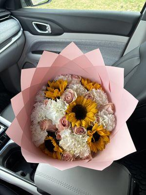 Freestyle pink bouquet. Sunflowers, carnations, and blush roses