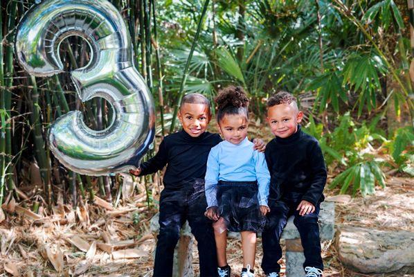 Ahian and his twins siblings, celebrating the twin's third birthday!