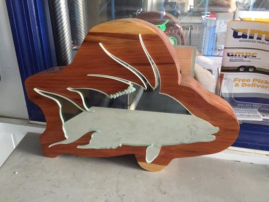 Wood and mirrored glass cut out with their TECHNI Water Jet!