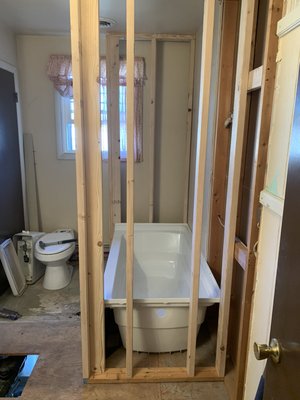 Redoing a bathroom tore out a wall