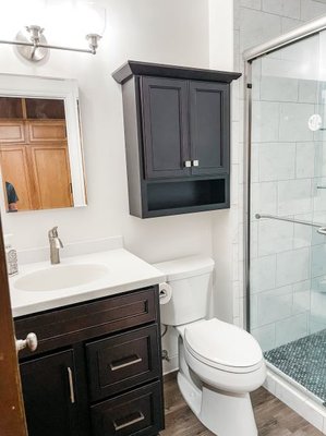 Complete bathroom remodel, enlarged shower space, custom shower with penny tile floor