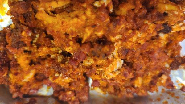 Add papitas and red chile to this delicious mixture of chorizo and eggs for an amazing breakfast burrito!