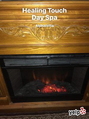 Cozy fireplace in massage room