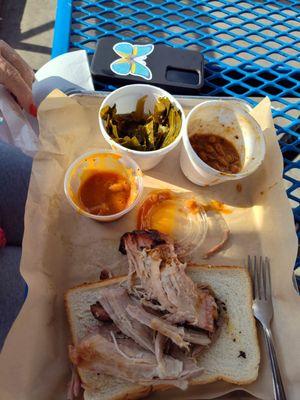 Pulled pork, always on white bread.  Collard greens, baked beans, BBQ sauce.