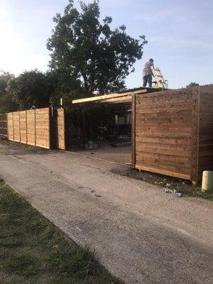 Horizontal cedar 8' high Automatic gate Medium brown stain