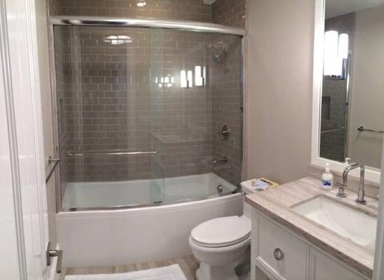 Renovated bathroom with custom tile.