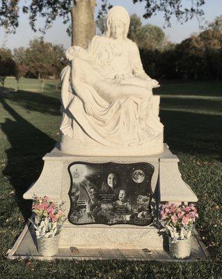 Marble Pieta on granite base