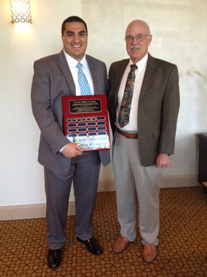 Dr. Michael Hoen presenting the Philip W. Cohen Memorial Scholarship Award in 2012 at the Michigan Association of Endodontists.