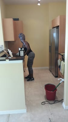 One of our staff members are cleaning the kitchen area. Call us TODAY (561)-275-3762