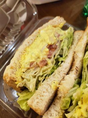 Egg salad with sourdough, lettuce and tomato