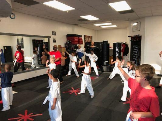 Kids in class spread out, learning a technique, masks are required, only if you want to wear them and not required at this time.