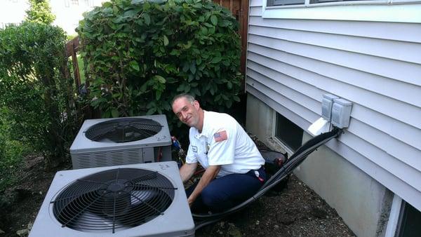 Tony making sure the A/C system is working at the proper efficiency.