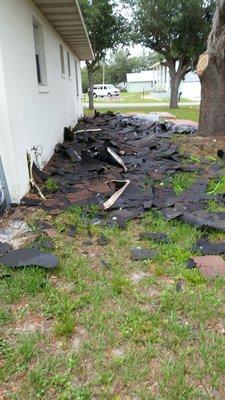 They dumped the old roof on the side of the house already stepped on 4 nails. They have created a safety hazard.