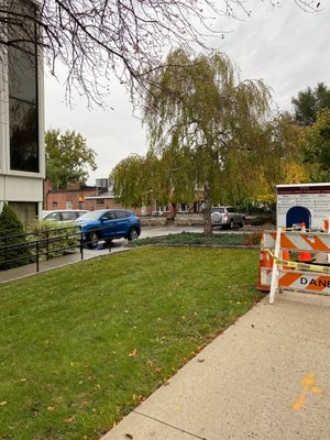 SIDE entrance parking lot that wraps around to the back of this building