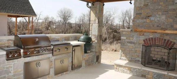 Outdoor fireplace and kitchen and stone work