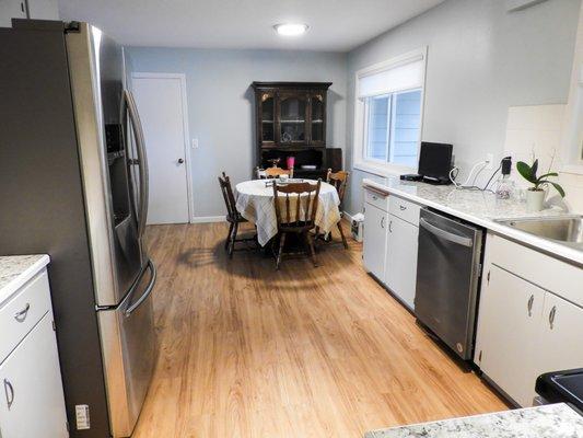 Opened up kitchen. Cabinet paint. New countertops. New appliances.