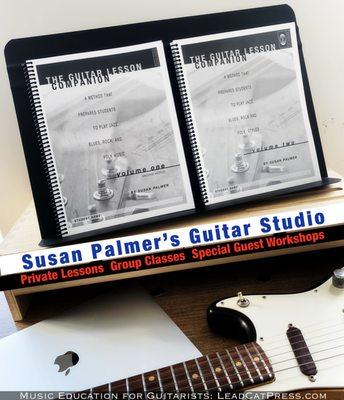 "The Guitar Lesson Companion" method books I wrote, next to my favorite Duo Sonic Guitar and the computer I use for online teaching.