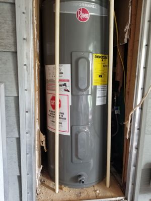 New water heater and replaced rotten wood, pipes, valves ..